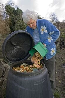 Images Dated 21st January 2006: Compost - woman tipping variety of kitchen waste
