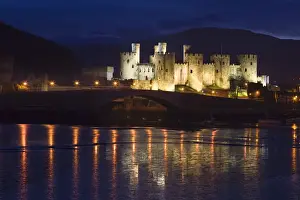 Estuary Prints: Conway Castle - at dusk with reflections in estuary - North Wales - UK
