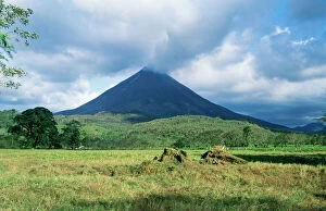 Central America Collection: Costa Rica DAD 1182 Arenal Volcano, steam forming on peak, where hot rock lava strikes cool air