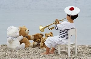 Boys Gallery: Cute - child on beach with teddy bears & trumpet Cute - child on beach with teddy bears & trumpet