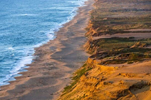 Dune Gallery: Days last light strikes the sandy shore