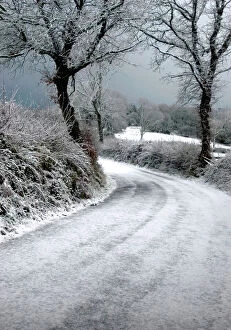 Road Collection: Devon - a country land after a snow storm UK. December