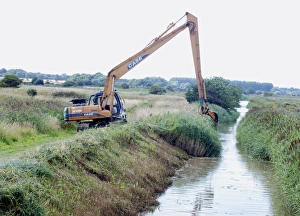 Images Dated 10th August 2009: Digging out a ditch on one side only to avoid breaking insect life cycles