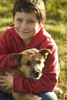 Dog - Boy holding Mongrel