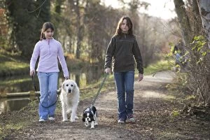 Images Dated 1st January 2008: Dog - Golden Retriever on walk with two girls