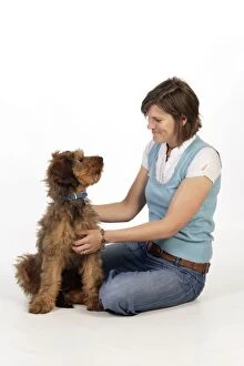 Berger Gallery: Dog - Puppy (Briard) & owner looking lovingly at each other Dog - Puppy (Briard)