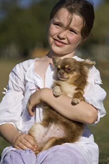 Dog - young girl cuddling Chihuahua