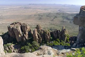 Dolerite pillars, part of a dolerite sill, up to 120 m high standing sentinel over surrounding Great Karoo plains. Valley of Desolation, Camdeboo National Park, Eastern Cape, South Africa
