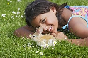 Domestic Rabbit - outside with young girl