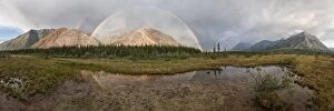 Double Rainbow over coloured mountains Boreal Forest