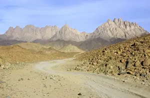 Egypt - road winds in rocks in Arabian desert approx. 50 km from Hurghada town (Red Sea shore), evening; January Eg39. 0225