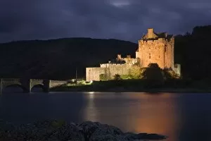 Images Dated 20th October 2006: Eilean Donan Castle - being lit up at dusk - November