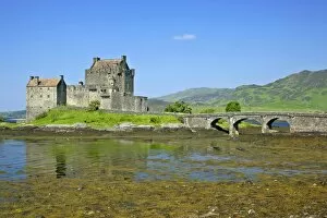 Eilean Donan Castle - view of castle located in Loch Duich at low tide on a sunny day