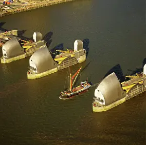 Boats Prints: England - Aerial view, Thames barrier and Thames Barge, London UK DW0631