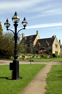 Images Dated 2nd August 2005: England - A Cotswold village thoroughfare on a Spring morning. April. Cotswolds, UK