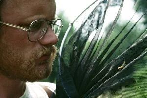 Images Dated 26th July 2004: Entomologist With Grasshopper, UK