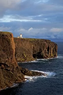 Esha Ness cliffs and lighthouse along cliffs edge