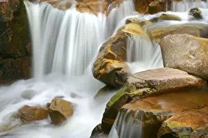 Etive river cascades water flowing over red rocks Etive River, Glen Etive, Glencoe area, Highlands, Scotland, UK
