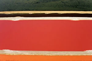 Deserts Collection: Evaporation ponds for the commercial extraction of sea salt - showing the bright resulting colours