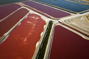 Evaporation ponds for the commercial extraction of sea salt - showing the bright resulting colours - Near Swakopmund - Namib Desert - Atlantic Coast - Namibia - Africa