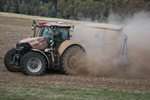 Farmer Gallery: Farm Tractor - veiled in dust, sowing out seed after the drought in August, 2018, North Hessen