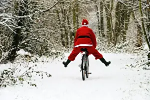 Father Christmas - on a bicycle, freewheeling