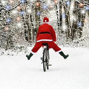 Images Dated 13th January 2010: Father Christmas - on a bicycle, freewheeling. Digital Manipulation: extra fur trim, lights