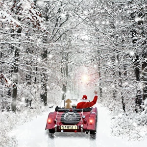 Father Christmas, in car waving goodbye with