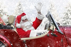 Images Dated 3rd February 2020: Father Christmas driving a sports car through winter scene Date: 16-Mar-10