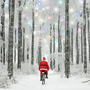 Christmas Prints: Father Christmas riding through woodland covered in winter snow with Christmas lights Digital Manipulation