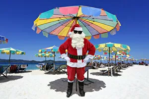 Images Dated 17th March 2020: Father Christmas / Santa Claus on beach, Khai Nai Island, Phuket, Thailand Date: 21-Jun-12