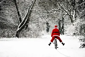 Transport Prints: Father Christmas - in snow - on bicycle freewheeling