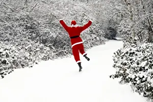 Father Christmas - in snow covered avenue