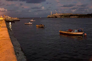 Fishing boats and El Morro Lighthouse, Havana