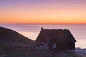 Fishing hut at the coast of Havaeng at sunrise - Sweden Fishing hut at the coast of Havaeng at sunrise - Sweden