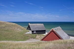 Fishing huts in the dunes along the Baltic Sea