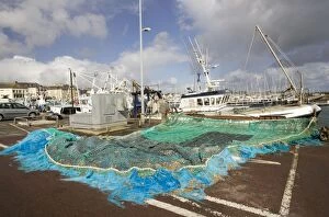 Images Dated 25th September 2007: Fishing nets and trawlers on quayside