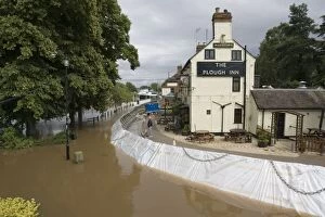 Images Dated 27th June 2007: Flood barriers outside Plough Inn fooded alongside River Severn in spate June 27 2007 Upton upon