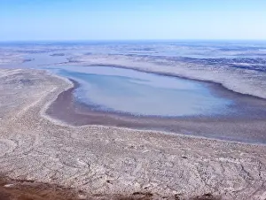 Floods Prints: Flood water flow into the Warbuton Groove-top of Lake Eyre