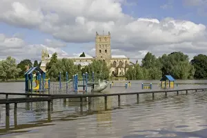 Floods Prints: Flooding - childrens playground underwater with Tewkesbury Abbey in background