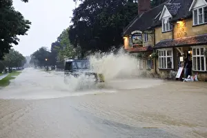 Roads Prints: Flooding - Landrover driving through torrents of flood water in high street Broadway Gloucestershire UK July 21 2007