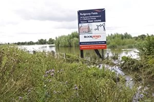 Images Dated 24th July 2007: Flooding - Large bill board adverting exclusive development of new houses on inundated flood plain