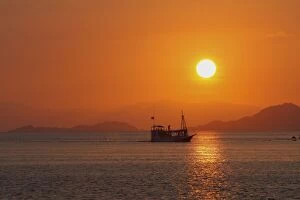 Images Dated 30th September 2008: Flores Island - showing boat transport to island at sunset. Indonesia