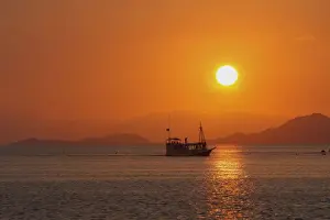Ferries Prints: Flores Island - showing boat transport to island at sunset. Indonesia