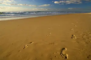 Footprints Prints: footprints in the sand - a pair of footprints in the sand are surely about to being washed away soon
