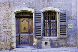 Barred Gallery: France, Arles. Stone doorway with wooden