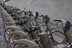 Bicycle Gallery: France, Paris. Line of bicycles for rent
