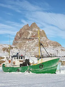 Ship Prints: The frozen harbor of Uummannaq during winter in northern West Greenland beyond the Arctic Circle