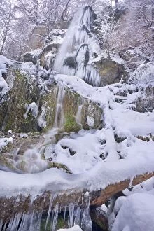 Images Dated 4th December 2010: Frozen Waterfall - a waterfall in winter with numerous icicles and snow and ice covered rocks