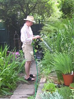 Garden - watering garden with hose